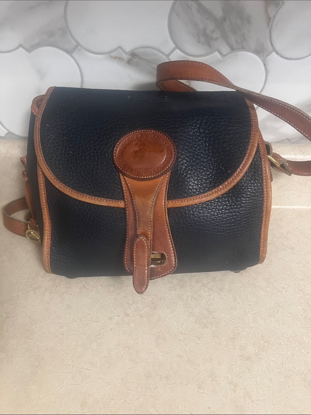 Dooney & Bourke Black Pebble Leather Crossbody Bag with Brown Trim